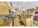 Kitchen with granite countertops, stainless steel appliances, and light wood cabinets at 6024 Resort Ridge St, Las Vegas, NV 89130