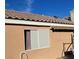 Rear exterior view showcasing a window and roofline at 1833 Oak Bluffs Ave, North Las Vegas, NV 89032