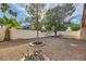 Landscaped backyard featuring gravel ground cover and mature trees at 3719 Lorraine Ln, Las Vegas, NV 89120