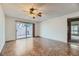 Bright living room with tile floors and sliding glass doors leading to a patio at 3719 Lorraine Ln, Las Vegas, NV 89120