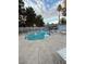 Community pool with lounge chairs and landscaping at 2121 Chertsey Dr # D, Las Vegas, NV 89108