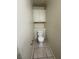 Small bathroom with toilet and overhead cabinet at 3923 Via Lucia Dr, Las Vegas, NV 89115