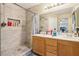 Double vanity bathroom with shower, and built-in shelving at 6046 Notre Dame Ave, Las Vegas, NV 89110