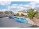 Relaxing freeform swimming pool with surrounding landscaping at 6046 Notre Dame Ave, Las Vegas, NV 89110