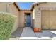 Front entry with blue door and pumpkins at 5653 Pleasant Palms St, North Las Vegas, NV 89081