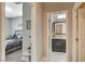 Hallway with bedroom and bathroom access, featuring light flooring and neutral walls at 5653 Pleasant Palms St, North Las Vegas, NV 89081