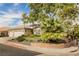 House exterior showcasing a three-car garage and landscaping at 1095 Endora Way, Boulder City, NV 89005