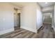 Bright hallway with white cabinets and wood-look floors at 453 Punto Vallata Dr, Henderson, NV 89011