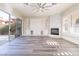 Living room with fireplace, built-ins, and hardwood floors at 453 Punto Vallata Dr, Henderson, NV 89011