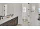 Modern bathroom with double vanity, a toilet and a mirror at 5714 Golden Chase Ct, Las Vegas, NV 89131