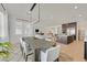 Open kitchen and dining area with hardwood floors and modern lighting at 5714 Golden Chase Ct, Las Vegas, NV 89131