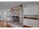 Stone fireplace with built-in shelving and hardwood floors at 530 E Fairway Rd, Henderson, NV 89015