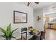 Bright dining area with glass table and four black chairs, adjacent to kitchen at 5250 S Rainbow Blvd # 2136, Las Vegas, NV 89118