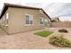 Landscaped backyard with artificial turf and desert landscaping at 2156 Del Aqua Ave, Henderson, NV 89002