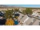 Aerial view of house and pool with mountain views at 7113 Maybrook Dr, Las Vegas, NV 89129