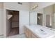 Bathroom with double sinks, mirrored medicine cabinet, and spacious closet at 7113 Maybrook Dr, Las Vegas, NV 89129