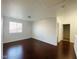 Spacious bedroom with wood flooring and access to a hallway at 10624 Night Magic Ct, Las Vegas, NV 89129