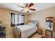 Bedroom with metal bed frame and ceiling fan at 208 Prince Ln, Las Vegas, NV 89110