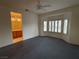 Main bedroom with bathroom access and ceiling fan at 2136 Desert Woods Dr, Henderson, NV 89012