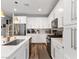 Modern kitchen with white cabinets and a large island at 342 Badinerie St, Henderson, NV 89011