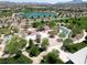 Aerial view of community park with lake and playground at 342 Badinerie St, Henderson, NV 89011