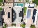 Aerial view of three homes with solar panels and a shared backyard space at 342 Badinerie St, Henderson, NV 89011