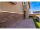 Neat side yard with stonework and a paved patio area at 342 Badinerie St, Henderson, NV 89011