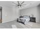 Primary bedroom with ceiling fan, neutral walls, and carpet flooring at 9611 Bruschi Ridge Ct, Las Vegas, NV 89149