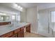 Elegant bathroom with double vanity, large mirror, and shower at 6608 Fort William St, North Las Vegas, NV 89084