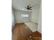 Bedroom with ceiling fan and hardwood floors at 11 Avenue I, McGill, NV 89318