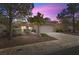 House exterior at dusk with mature landscaping at 2216 Spring Water Dr, Las Vegas, NV 89134