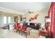 Bright and airy living room with hardwood floors and comfortable seating at 10385 Luna Magico Ave, Las Vegas, NV 89135