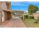 Covered patio, inviting pool, and lush green lawn in the backyard at 7604 Charles Conrad Cir, Las Vegas, NV 89145