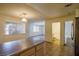 Kitchen with island, stainless steel refrigerator, and view of bathroom at 825 Hedge Way # 4, Las Vegas, NV 89110