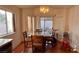 Bright dining area with wood table and chairs, hardwood floors at 1705 Imperial Cup Dr, Las Vegas, NV 89117