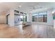 Bright living room with hardwood floors, fireplace, and sliding glass doors leading to backyard at 477 Highview Ridge Ave, Las Vegas, NV 89138