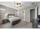 Bright bedroom with a king-size bed and ensuite bathroom access at 10 Via Tiberina, Henderson, NV 89011