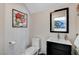 Elegant powder room with dark vanity and framed art at 8128 Bay Harbor Dr, Las Vegas, NV 89128