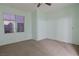 Large bedroom with window and neutral wall color at 9630 Desert Daisy Ct, Las Vegas, NV 89178