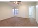 Bright bedroom with neutral walls, carpeting and a window with blinds at 9630 Desert Daisy Ct, Las Vegas, NV 89178