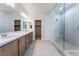 Modern bathroom boasts double vanity and large shower at 301 La Musica Pl, Henderson, NV 89015