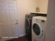 Laundry room with washer, dryer, and storage shelf at 2758 Tilten Kilt Ave, North Las Vegas, NV 89081