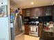 Well-equipped kitchen featuring granite countertops and dark wood cabinets at 2813 Searles Ave, Las Vegas, NV 89101