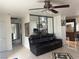 Living room with brown leather couch and tile floors at 2813 Searles Ave, Las Vegas, NV 89101