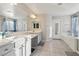 Double vanity bathroom with a large soaking tub at 969 Cutter St, Henderson, NV 89011