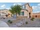 Two-story house with gray garage door and stone accents at 969 Cutter St, Henderson, NV 89011