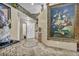 Elegant entryway with decorative tile floor and large artwork at 1111 N Christy Ln, Las Vegas, NV 89110