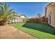 Backyard with artificial turf and a wooden fence at 1111 N Christy Ln, Las Vegas, NV 89110