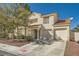 Two-story house with two car garage and desert landscaping at 2133 Desert Pines St, Las Vegas, NV 89134