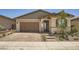 House exterior with brown garage door and landscaping at 469 Open Hill Ave, Henderson, NV 89011